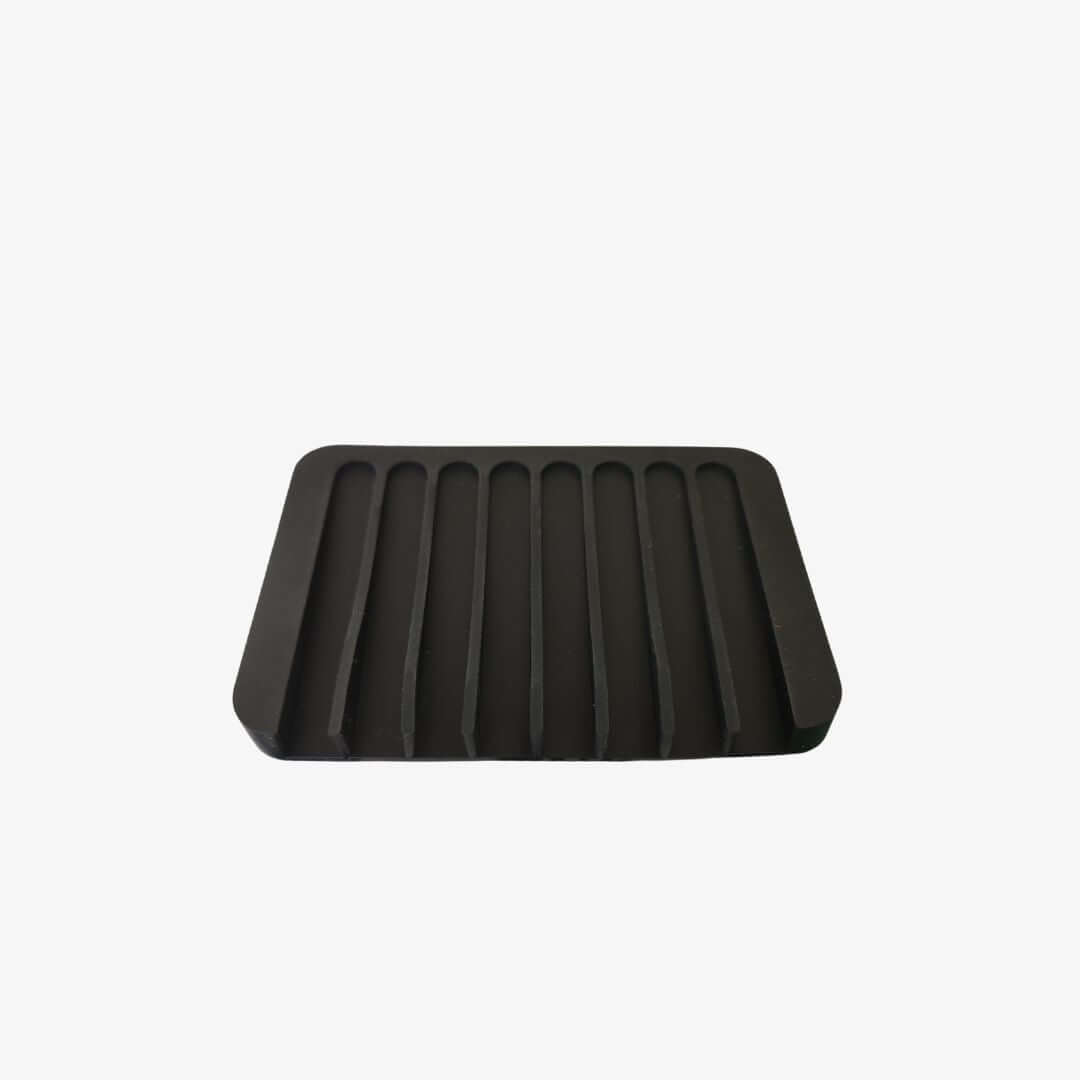 Porte-savon en silicone noir, design élégant avec drainage efficace pour savon solide.