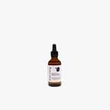 Flacon d'huile protectrice pour cheveux colorés, nourrit et préserve l'éclat. Formule naturelle à 98,9%.